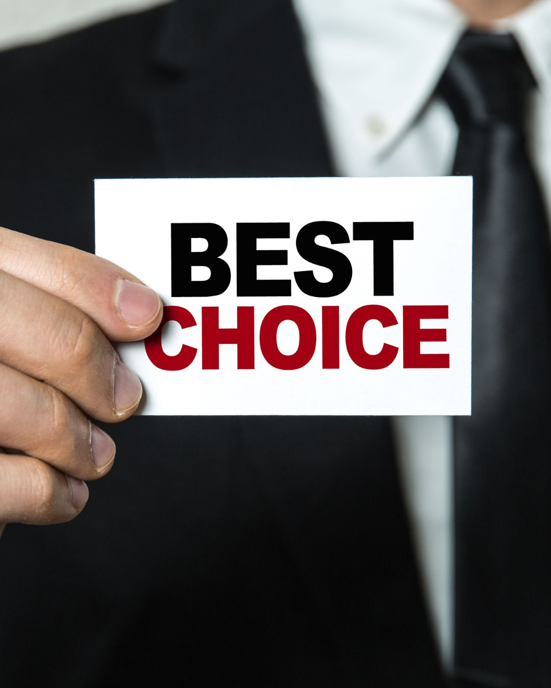 Business professional holding a card with the words Best Choice in bold text