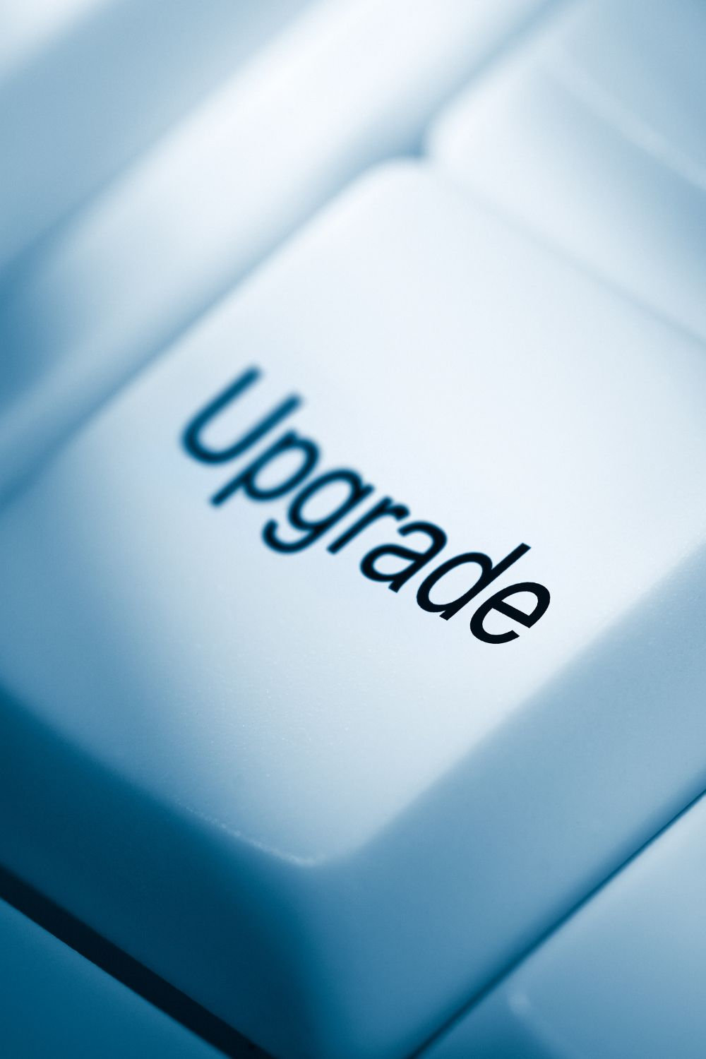 Close-up of a keyboard key with the word Upgrade, symbolizing website updates and digital improvements.