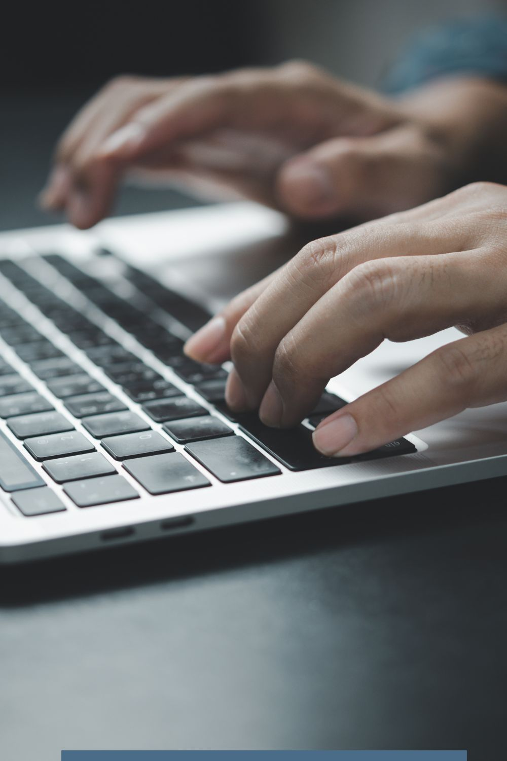 Hands typing on a laptop keyboard, showing digital marketing work and planning for social media apps 2025 predictions.