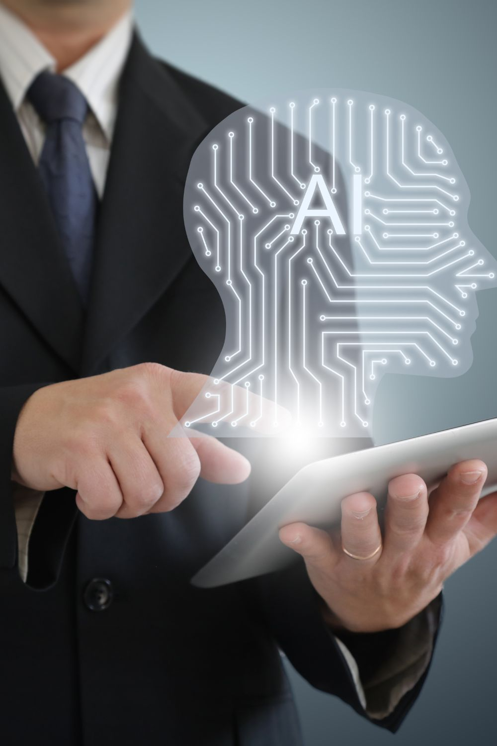 Business professional using tablet with AI technology graphic representing artificial intelligence in marketing