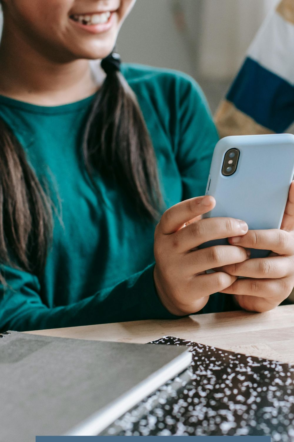 Young girl using smartphone to browse social media apps