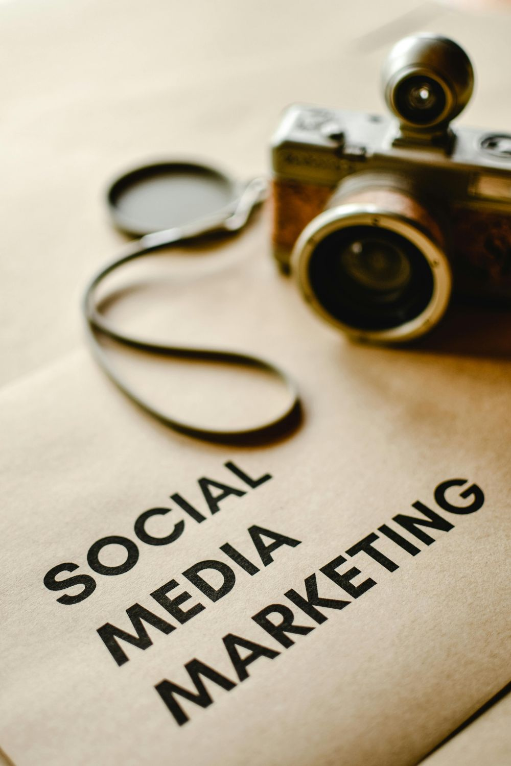 Vintage camera placed on paper with the words Social Media Marketing, representing digital strategy and content creation in 2025